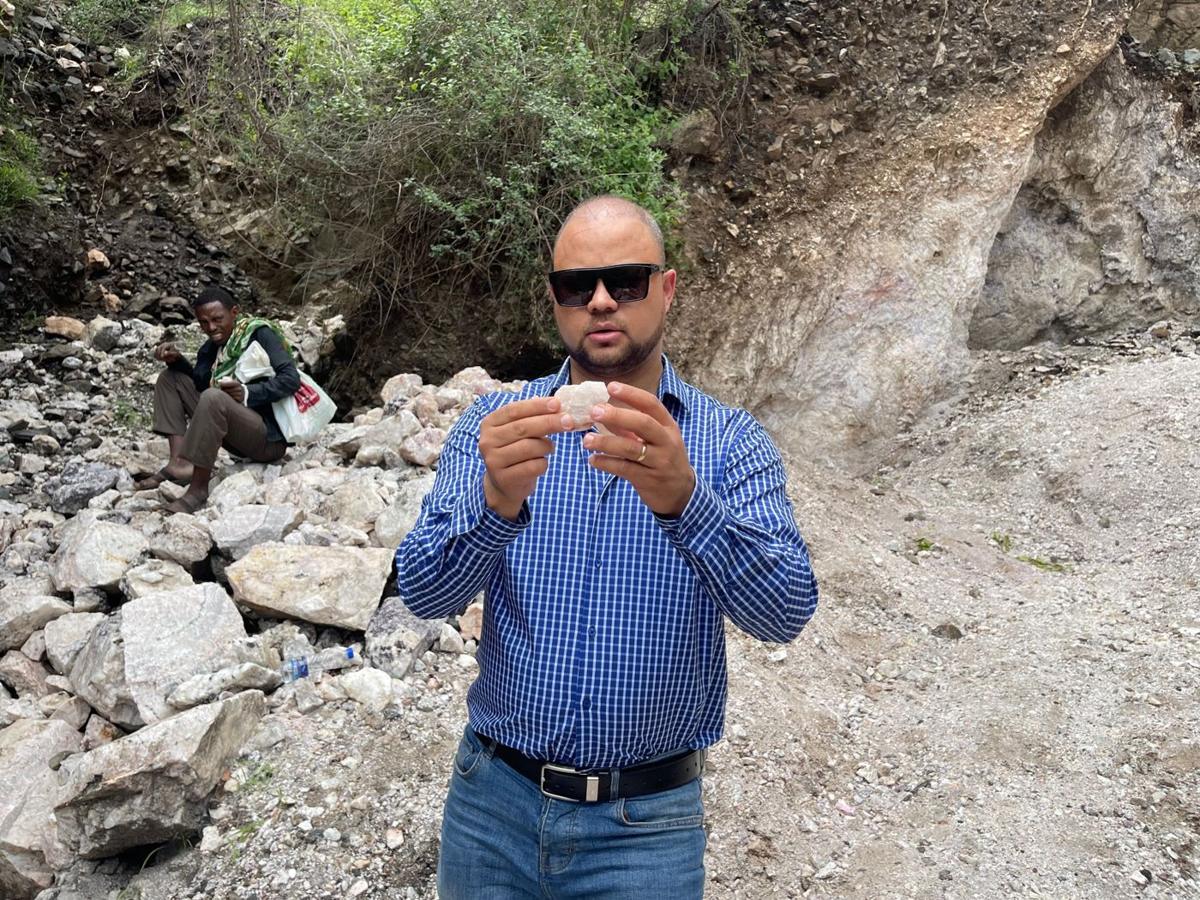 Tomas Vacilevich inspecting ore at an Ethiopian mining site